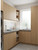 A modern utility room wrapped in Layed Honey Oak Wood Vinyl Wrap HOW57, showcasing its highly realistic, embossed wood grain texture and warm honey-blonde finish.