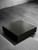 A modern, minimalist square coffee table seamlessly transformed with Layed Royal Black Satin Marble Vinyl Wrap, showcasing its elegant dark stone texture and crisp white veining.