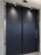 Lift doors flawlessly upgraded using the deep, light-catching tones of Layed Brushed Metal Navy Blue Vinyl Wrap.