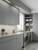 Modern laundry room featuring built-in cabinets and open shelving smoothly finished in Layed Matte Textured Rock Grey Vinyl Wrap MTRG14.