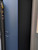 Close-up view of a tall kitchen pantry cabinet beautifully upgraded with Layed Matte Silk Navy Blue Vinyl Wrap, showcasing the smooth, flawless matte texture.