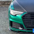 Demonstrating high conformability of Metallic Isle of Man Green wrap around curved front bumper