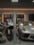 Sports car and motorcycle wrapped in Super Gloss Metallic Liquid Silver vinyl wrap SGM-LS51 beside standing roll