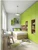 A modern children's bedroom featuring a large built-in wardrobe, integrated wood shelving, and floating wall cubbies finished in vibrant Matte Textured Apple Green vinyl wrap.