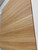 A detailed close-up of a flat panel wrapped in Layed Natural Pine Wood Vinyl Wrap, emphasizing the realistic, embossed wood grain texture and light blonde finish.