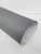 A sample of Layed Graphite Linen Fabric Vinyl Wrap roll, highlighting the intricate interlocking textile pattern and premium matte finish.