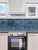 Marine blue peel and stick tiles installed vertically on a stylish feature wall