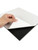 Hand peeling back the protective film from a self-adhesive black tile backing to demonstrate easy 'peel and stick' installation