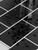 Close up of black subway peel and stick tiles showing gloss finish and texture detail