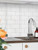 Layed WSTL63 white subway peel and stick composite tiles used for a clean kitchen splashback design