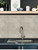 Stone concrete subway peel and stick tiles creating a natural feature wall in a modern interior