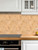 Heat-resistant Oak Wood Hexagon composite tiles installed as a durable backsplash behind a kitchen stovetop.