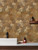 A contemporary commercial space with geometric Bronze Metal hexagon composite tiles used as decorative wall cladding.