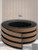 Close-up shot showing the flexible nature of the layed peel and stick slatted panels, perfect for easy DIY application.