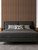 A minimalist bedroom design using Smoked Walnut panels to create a floor-to-ceiling decorative headboard.
