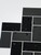 Waterproof Onyx Black Herringbone composite tiles used as a bathroom vanity backsplash.