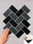 Layed Onyx Black Herringbone peel and stick composite wall tiles, model OBHT61.