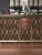 Copper metal picket tiles installed on an Industrial style bar.