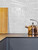 Fan-shaped white marble peel and stick composite wall tiles (FSWMT51) arranged in a decorative pattern for a backsplash.