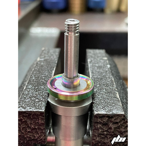JBI Titanium Leaf Spring Cup on showa midvalve piston post with collar and shims