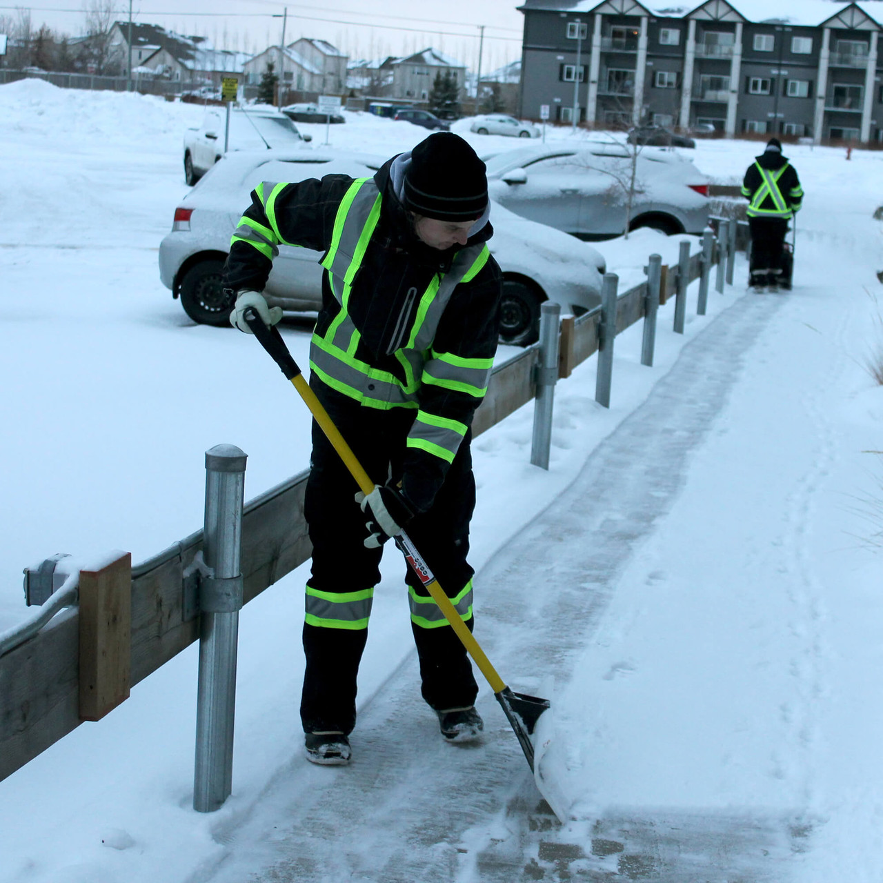 https://cdn11.bigcommerce.com/s-4208f/images/stencil/1280x1280/products/34030/23596/S457-SP03-Woman-shovelling-snow-in-a-duck-safety-jacket-and-flex-twill-safety-cargo-pants__11461.1673456250.jpg?c=2?imbypass=on