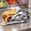 Solex paper-backed insulated foil sandwich wrap on a deli prep counter
