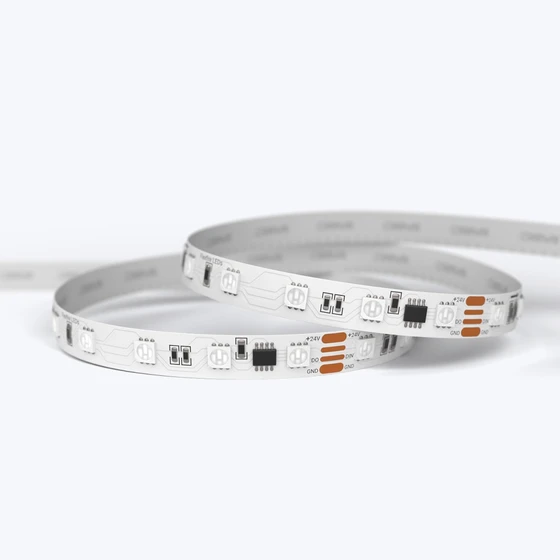 A coiled ColorBright™ RGB Digital Pixel IP20 LED Strip showing the high-density circuit board and 3M adhesive backing.