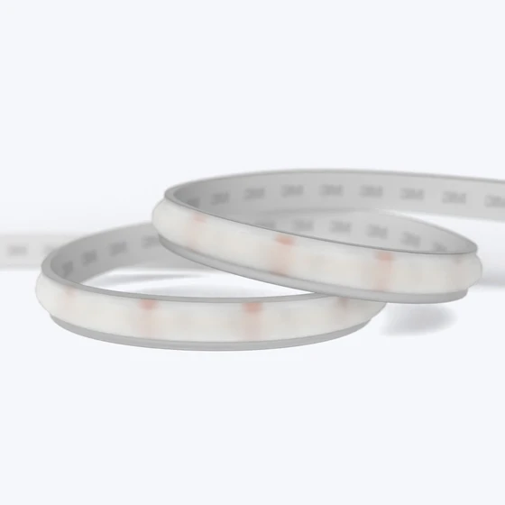 A coiled Valor™ Diffused IP67 LED Strip showing its flexible frosted casing and 3M adhesive backing on a white background.