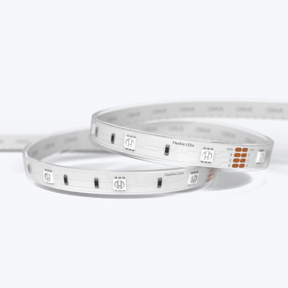 A coiled Outdoor ColorBright™ RGB 150 IP65 LED Strip with a silicon-coated circuit board and 3M adhesive backing.