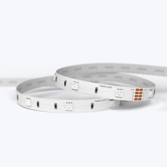 A coiled ColorBright™ RGB 150 IP20 LED Strip showing the high-quality circuit board and 3M adhesive backing.