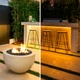 Split view of an outdoor bar with the Outdoor UltraBright™ Sienna Dim-to-Warm IP65 LED Strip, showcasing warm under-counter hues.