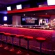 Lounge bar seating area with bold red accent lighting from high-output ColorBright™ RGB 600 IP20 LED Strips.