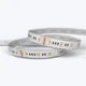 A coiled Outdoor ColorBright™ RGB + Tunable White IP65 LED Strip with a silicon-coated circuit board and 3M adhesive backing.