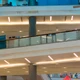 Valor™ Diffused IP67 LED Strips providing linear cove lighting along multi-level balconies in a modern commercial space.