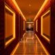 ColorBright™ Vivid Single-Color IP20 LED Strip Light framing wall panels and ceiling coves in warm amber along a hallway.