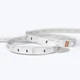A coiled Outdoor ColorBright™ RGB 150 IP65 LED Strip with a silicon-coated circuit board and 3M adhesive backing.