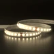 Outdoor Vital™ 300 White IP65 LED Strip illuminated in a soft 3000K warm white glow while coiled on a reflective surface.