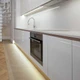 Modern white kitchen with under-cabinet and toe-kick installs using Outdoor UltraBright™ Verity SOB Diffused IP65 LED Strips.