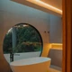 Outdoor UltraBright™ Architectural Dynamic Tunable White IP65 LED Strip adding warm lighting around a freestanding bathtub.