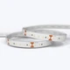 A coiled Outdoor UltraBright™ Outline IP65 LED Strip showing the silicon-coated circuit board and 3M adhesive backing.
