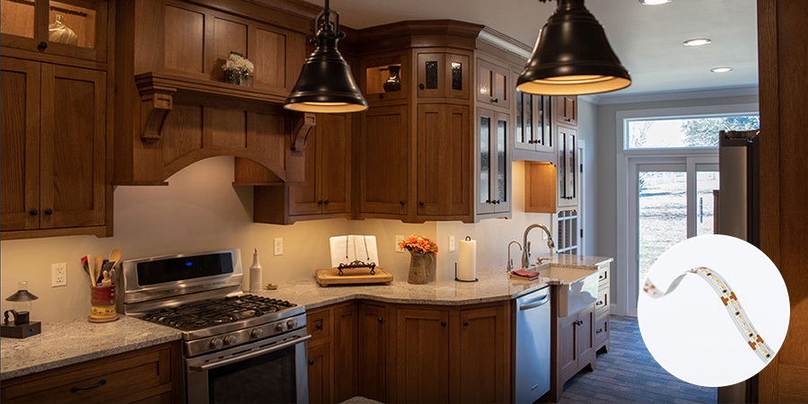 Warm traditional kitchen with under-cabinet lighting by Flexfire LEDs, highlighting wood cabinetry and a cozy ambiance.