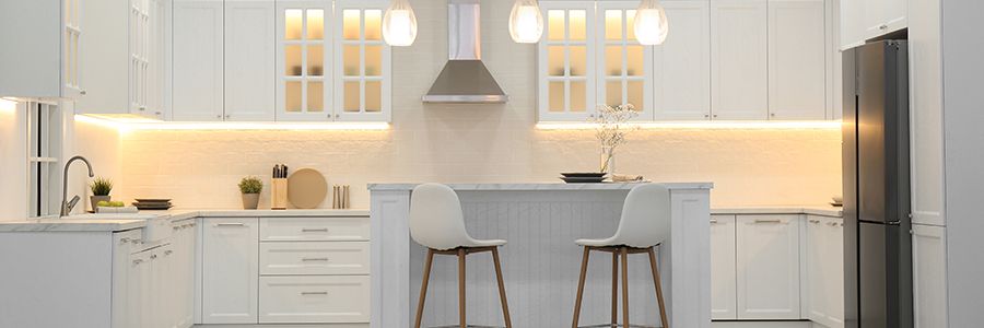 What Are the Best LED Lights for Your Kitchen? Modern white kitchen illuminated with Flexfire LEDs under cabinet and accent lighting.