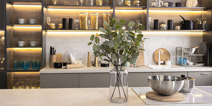 Contemporary kitchen with warm under-cabinet lighting by Flexfire LEDs highlighting open shelving and modern decor.