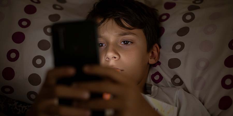 Chil Using Phone at Night