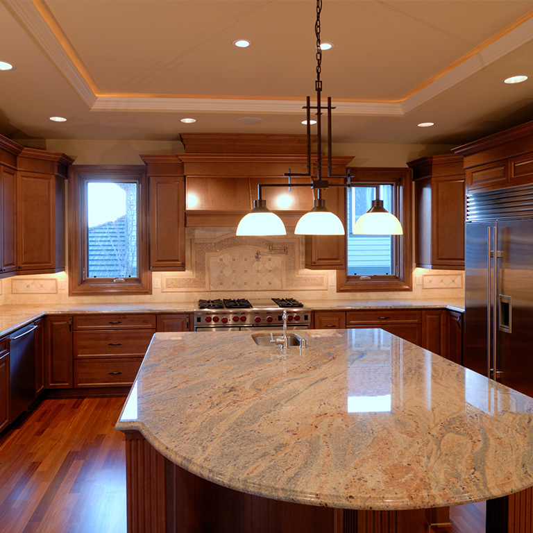 Modern kitchen with wood cabinets and ambiented LED cove lighting