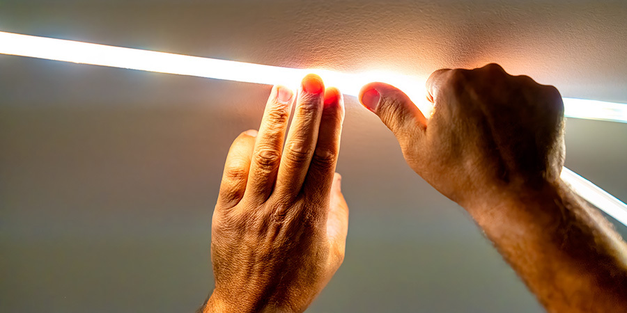 Person installing LED lighting