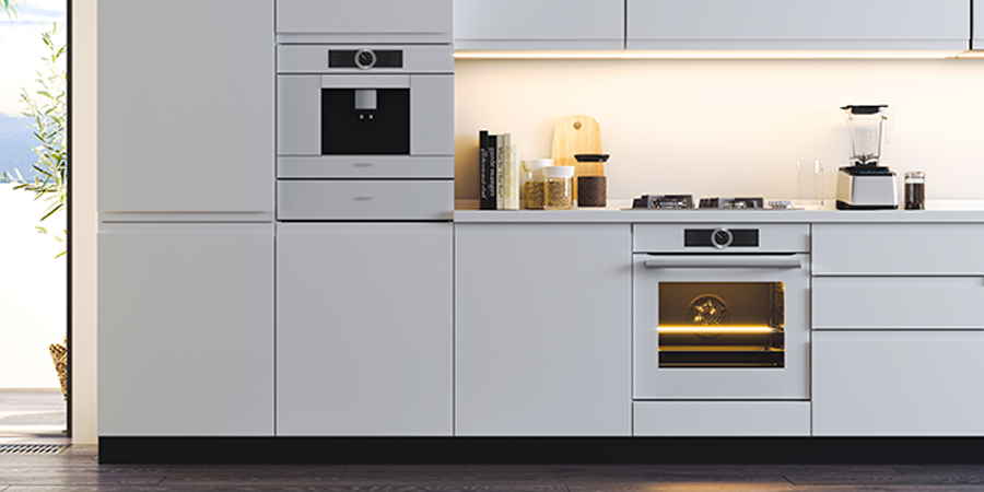 Modern kitchen with built-in appliances and under-cabinet lighting