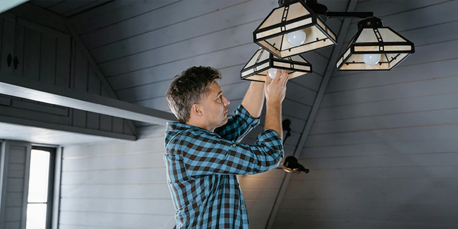 Person installing LED lights bulbs