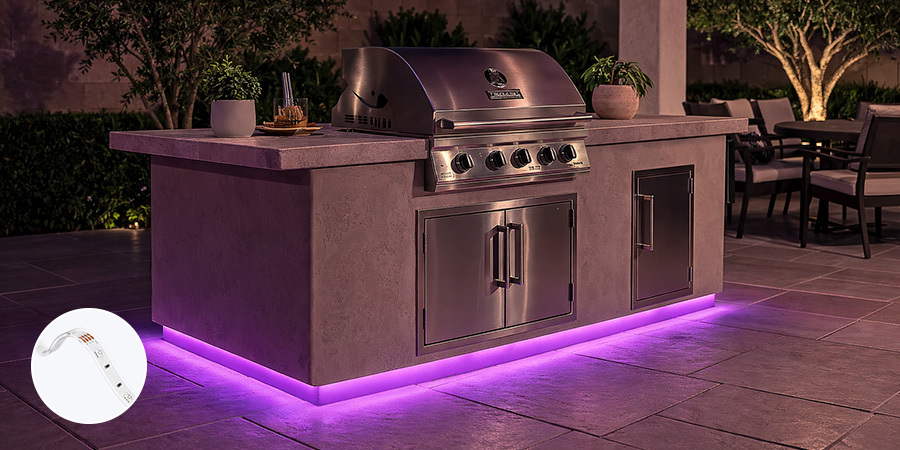 Outdoor grill island with RGB toe kick lighting