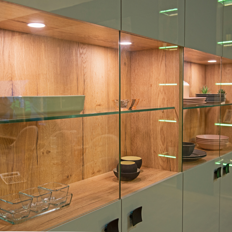 Victory Select LED puck lights inside glass display cabinet accent lighting